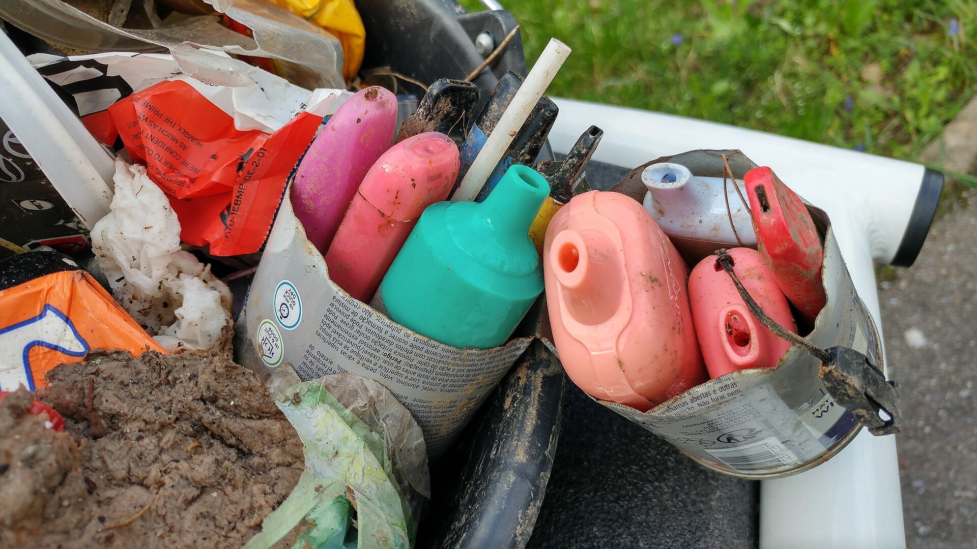 Real photo of collected single-use vape devices awaiting take-back and recycling